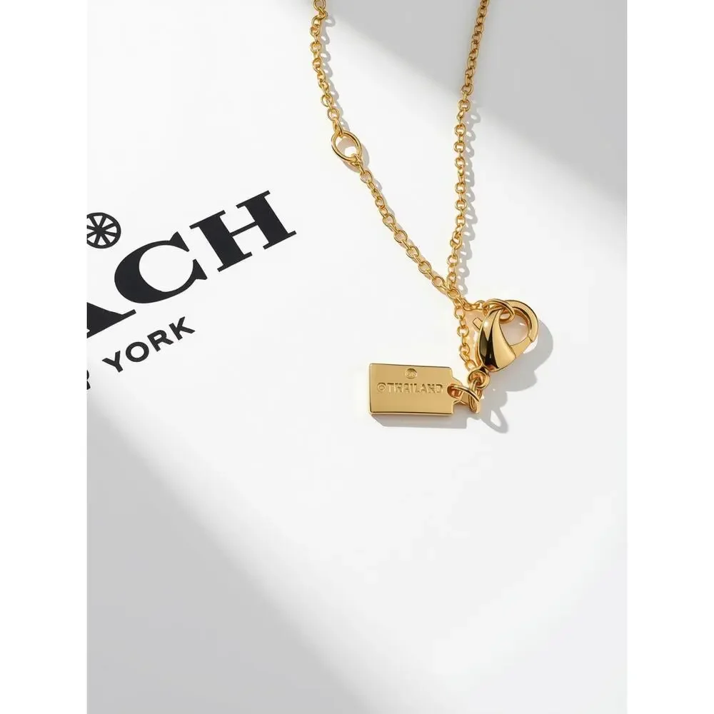 Coach Quilted Monogram Padlock & Key gold-tone necklace